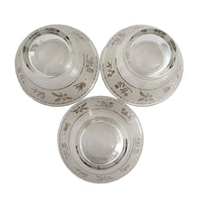 Load image into Gallery viewer, A super cool piece of mid-century history in this Hollywood regency style 3-tier chrome relish or snack caddy featuring a leaf medallion and spring handle, with three glass bowls with a pattern of silver birds and botanicals on a frosted band and silver ric rac detail below the rim. Crafted by the Libbey Glass Company, USA, circa 1960s. Wow your guests with this fabulous and practical serving piece for condiments, bar snacks or sundae toppings!