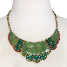 Load image into Gallery viewer, Close-up of emerald enamel crescent pendant with green rhinestones and turquoise coral beading on vintage Tibetan-style necklace