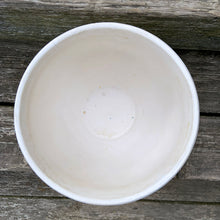 Load image into Gallery viewer, A large vintage "Tierra Cushion" jardiniere or planter pot, glazed in matte white featuring three dimensional flowers and leaves atop a diamond quilted body with ribbon handles. This beauty was produced by McCoy Pottery USA, 1950s. An excellent addition to any art pottery collection!