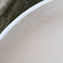 Load image into Gallery viewer, A large vintage "Tierra Cushion" jardiniere or planter pot, glazed in matte white featuring three dimensional flowers and leaves atop a diamond quilted body with ribbon handles. This beauty was produced by McCoy Pottery USA, 1950s. An excellent addition to any art pottery collection!