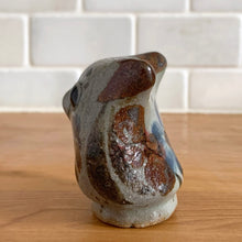 Load image into Gallery viewer, Vintage hand crafted Tonala folk art pottery owl figurine, hand painted and signed by artist Jorge Wilmot, Mexico. This owl has striking eyes, florals in ochre, brown and blue on a gray ground.
In excellent condition, no chips/cracks/repairs.
Measures 2 1/4 x 2 x 2 3/8 inches