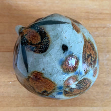 Load image into Gallery viewer, Vintage hand crafted Tonala folk art pottery owl figurine, hand painted and signed by artist Jorge Wilmot, Mexico. This owl has striking eyes, florals in ochre, brown and blue on a gray ground.
In excellent condition, no chips/cracks/repairs.
Measures 2 1/4 x 2 x 2 3/8 inches