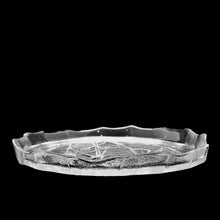 Load image into Gallery viewer, Vintage Tree Branches clear pressed art glass serving plate featuring tree branches on a textured surface reminiscent of the rings in a tree trunk and the free flowing folded rim represent the bark of the tree. Crafted by Kosta Boda, Sweden, 1970s. Perfect for serving small bites, or display on a stand as art.
In excellent condition, no chips.
Measures 8 inches