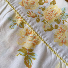 Load image into Gallery viewer, Lovely vintage Truprest yellow Rose Romance poly cotton queen size flat bed sheet featuring roses in shades of yellow with pale blue and green leaves finished with yellow trim at the band. Crafted by Texmade, Canada, 1973-1977. Create a restful slumber with these beautifully designed and well-made linens or use for crafting or garment making.
In good used vintage condition, no tears/stains.
Measures 88 x 108 inches
