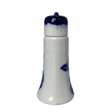 Load image into Gallery viewer, Side view of the ironstone sugar shaker showing a mostly white panel between blue floral motifs