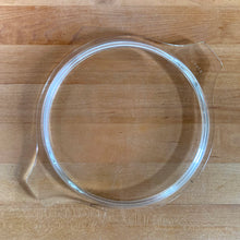 Load image into Gallery viewer, Overhead view of clear glass PYREX 474-C round casserole lid with Cinderella tab handles