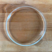 Load image into Gallery viewer, Underside view of clear glass PYREX 474-C round casserole lid with Cinderella tab handles