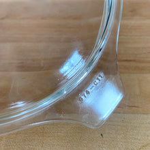 Load image into Gallery viewer, Overhead view of clear glass PYREX 474-C lid showing embossed model number 474-C11 and rim detail