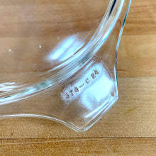 Load image into Gallery viewer, Close-up of clear glass PYREX 474-C lid handle tab showing embossed model number "474-C 24"