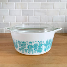 Load image into Gallery viewer, Vintage turquoise PYREX Butterprint casserole dish with glass lid, Model 474-B, 1.5 Qt, shown with lid on from a front three-quarter angle