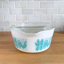 Load image into Gallery viewer, Vintage turquoise PYREX Butterprint casserole dish with lid, side profile view showing turquoise-on-white rooster and wheat Butterprint pattern
