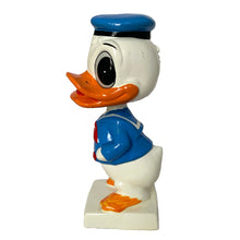 Load image into Gallery viewer, Vintage Walt Disney World Donald Duck paper mache bobble head nodder figurine. Crafted in Japan, 1960s (likely manufactured by Ardco). This beloved collectible along with its nodding head figurine adds a whimsical touch to any room or display. A must-have for any Disney enthusiast. This is a great opportunity for a Disney fan to own a piece of history and to add to their collection.