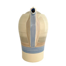 Load image into Gallery viewer, Vintage Art Deco style Wedding Ring coffee set in the blue, rust and gray colourway. Crafted by Susie Cooper, England, 1930s. This kestrel-shaped set comprised of a coffee pot with lid, creamer and sugar with four demitasse cups and saucers.
The set is in generally good vintage condition with no chips, cracks, or repairs. Each piece shows age-related crazing. The coffee pot has a chip at the top of the spout, and the sugar bowl has staining on the bottom. All pieces have maker's marks.