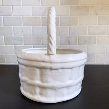 Load image into Gallery viewer, Vintage white ceramic basket planter with rope style handle. Its size and makes it great for creating a mini indoor garden! Marker's mark on the bottom, but it's indecipherable. In excellent condition, free from chips/cracks/repairs. Measures 8 x 9 1/2 inches