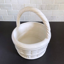 Load image into Gallery viewer, Vintage white ceramic basket planter with rope style handle. Its size and makes it great for creating a mini indoor garden! Marker's mark on the bottom, but it's indecipherable. In excellent condition, free from chips/cracks/repairs. Measures 8 x 9 1/2 inches