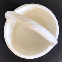 Load image into Gallery viewer, Vintage white ceramic basket planter with rope style handle. Its size and makes it great for creating a mini indoor garden! Marker's mark on the bottom, but it's indecipherable. In excellent condition, free from chips/cracks/repairs. Measures 8 x 9 1/2 inches