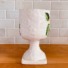Load image into Gallery viewer, Pretty vintage pedestal planter in white with embossed daisies in white, yellow with green leaves. Produced by Rubens Originals, Japan, circa 1950s. In excellent condition, free from chips/cracks/repairs. Normal crazing present. Measures 4 1/8 x 6 3/4 inches