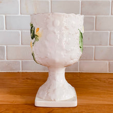 Load image into Gallery viewer, Pretty vintage pedestal planter in white with embossed daisies in white, yellow with green leaves. Produced by Rubens Originals, Japan, circa 1950s. In excellent condition, free from chips/cracks/repairs. Normal crazing present. Measures 4 1/8 x 6 3/4 inches