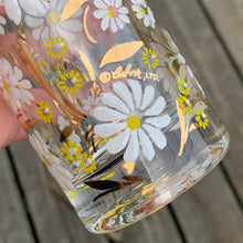 Load image into Gallery viewer, Detail of raised white enamel daisy pattern on vintage Culver luxury barware with Culver signature