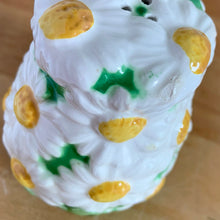 Load image into Gallery viewer, Pretty vintage mid-century hand painted "Daisytime" ceramic salt and pepper shakers featuring an overall pattern of raised white daisy flowers with yellow centres and green leaves. Crafted by PY, Japan, circa 1950s. A pretty addition to any tablescape! In vintage condition, minor flea bites, no cracks/repairs. Original corks are inside with new corks provided. Bottoms marked "Daisytime PY 22648" Measures 2 1/2 x 3 5/8 inches