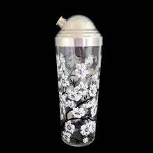 Load image into Gallery viewer, Vintage white Dogwood flower cocktail shaker with five matching glasses. Crafted by Hazel-Atlas Glass, USA, 1930s/40s. A wonderful Art Deco set to add to your barware collection!
In good used vintage condition, no chips or wear to the paint. Lid has age-related wear.
Shaker measures 3 1/4 x 10 1/4 inches, capacity 24 ounces
Glasses measures 2 3/8 x 3 3/4 inches, capacity 4 ounces