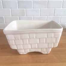 Load image into Gallery viewer, Vintage gloss white glazed figural rectangular strawberry basket ceramic planter. Crafted by Brush Pottery, 1940s. This rare piece is must for any Brush art pottery collector!
In excellent vintage condition, no chips/cracks/repairs. Maker's mark.
Measures 7 1/2 x 5 1/2 x 4 1/8 inches