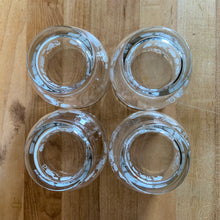 Load image into Gallery viewer, Vintage drinkware featuring a band of white grapevines on feminine flared shaped clear glass in 6, 8 and 10 ounce sets of four. Manufactured by St. Clair Division of Domglas Ltd., Canada, circa 1970s. These glasses are lovely and would make a perfect housewarming gift! In excellent condition, new old stock in original boxes.