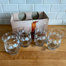 Load image into Gallery viewer, Vintage drinkware featuring a band of white grapevines on feminine flared shaped clear glass in 6, 8 and 10 ounce sets of four. Manufactured by St. Clair Division of Domglas Ltd., Canada, circa 1970s. These glasses are lovely and would make a perfect housewarming gift! In excellent condition, new old stock in original boxes.