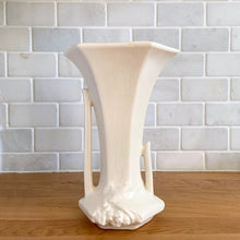 Load image into Gallery viewer, Rear view of the vase highlighting the asymmetric handle shapes and embossed leaf motif at the base. Nelson McCoy Pottery, 1940s