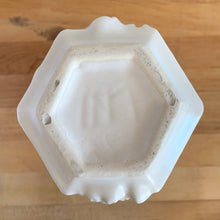 Load image into Gallery viewer, Base view of the matte white vase showing hexagonal base and maker's mark. Nelson McCoy Pottery, USA 1940s.