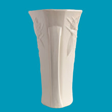 Load image into Gallery viewer, Exceptionally beautiful vintage matte white Butterfly Line vase, features clusters of butterflies on the front and back, a unique split foot and strap handles. Crafted by McCoy Pottery, early 1940s. This rare vase must for any art pottery collector!
In excellent vintage condition, no chips, no cracks, no repairs, crazing commensurate with age. Impressed 'USA' mark on the split foot.
Measures 6 1/2 x 5 1/2 x 10 3/8 inches