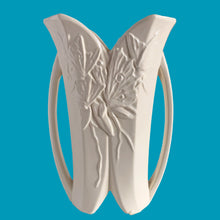 Load image into Gallery viewer, Exceptionally beautiful vintage matte white Butterfly Line vase, features clusters of butterflies on the front and back, a unique split foot and strap handles. Crafted by McCoy Pottery, early 1940s. This rare vase must for any art pottery collector!
In excellent vintage condition, no chips, no cracks, no repairs, crazing commensurate with age. Impressed 'USA' mark on the split foot.
Measures 6 1/2 x 5 1/2 x 10 3/8 inches