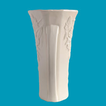 Load image into Gallery viewer, Exceptionally beautiful vintage matte white Butterfly Line vase, features clusters of butterflies on the front and back, a unique split foot and strap handles. Crafted by McCoy Pottery, early 1940s. This rare vase must for any art pottery collector!
In excellent vintage condition, no chips, no cracks, no repairs, crazing commensurate with age. Impressed 'USA' mark on the split foot.
Measures 6 1/2 x 5 1/2 x 10 3/8 inches