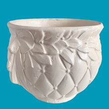 Load image into Gallery viewer, Large vintage Tierra Cushion jardiniere planter pot, aqua shiny glaze, features an overlapping floral leaf pattern around the top rim, a diamond quilted body and ribbon handles. Crafted by McCoy Pottery, USA, 1950s. A must-have for any McCoy collector or gardener!
In good vintage condition, free from chips, cracks or repairs, with crazing commensurate with age, see photos. Maker's mark is on the bottom.
Measures 8 3/4 x 7 1/2 inches