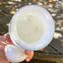 Load image into Gallery viewer, This vintage 1970s white milk glass apothecary jar, with a bubble-shaped lid is a classic piece of vintage glass decorated with pink roses and gold trim. Could be used as a kitchen canister, bathroom apothecary jar or as a beautiful display piece. It has a plastic piece that makes a great seal if using for food storage. Marked on the bottom "Container Made in Belgium". Circa 1970s/1980s. In excellent condition, no chips or cracks. Measures 2-1/8" x 5-1/2"