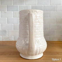 Load image into Gallery viewer, Antique vintage art deco matte white Rosella no. 320 ceramic yellow ware pitcher featuring climbing roses on a basketweave pattern. Crafted by Robinson Ransbottom Pottery Co., USA, 1920s. A beautiful piece of art pottery to add to collection. Makes a wonderful vessel for a floral arrangement.
Option 1: 6 1/2 x 7 5/8 inches
In excellent vintage condition, no chips/cracks/repairs, age-related crazing and typical manufacturing glaze pops. Maker's mark.