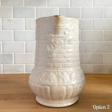Load image into Gallery viewer, Antique vintage art deco matte white Rosella no. 320 ceramic yellow ware pitcher featuring climbing roses on a basketweave pattern. Crafted by Robinson Ransbottom Pottery Co., USA, 1920s. A beautiful piece of art pottery to add to collection. Makes a wonderful vessel for a floral arrangement.
Option 2: 6 1/2 x 7 5/8 inches
In as found vintage condition, chips to the spout, no cracks/repairs, age-related crazing and typical manufacturing glaze pops. Maker's mark.