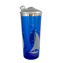 Load image into Gallery viewer, Side view of 1930s Hazel-Atlas cobalt blue glass cocktail shaker showing white enamel sailboats and seabirds decoration, Art Deco design