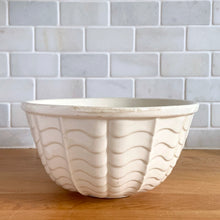 Load image into Gallery viewer, Vintage glossy white ceramic mixing bowl with an exterior pattern of horizontal waves. Crafted by Robinson Ransbottom Pottery Co., USA, 1960s. A beautiful piece to add to your kitchen's art pottery collection!
In excellent condition, no chips/cracks/repairs, wear to the rim. Maker's marks.
Measures 8 1/4 x 4 1/4 inches