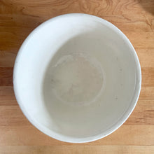 Load image into Gallery viewer, Vintage glossy white ceramic mixing bowl with an exterior pattern of horizontal waves. Crafted by Robinson Ransbottom Pottery Co., USA, 1960s. A beautiful piece to add to your kitchen's art pottery collection!
In excellent condition, no chips/cracks/repairs, wear to the rim. Maker's marks.
Measures 8 1/4 x 4 1/4 inches