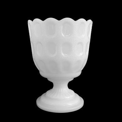 Bring classic charm to your space with this vintage mid-century white milk glass footed planter! Its stunning window pane design with scalloped edge creates a timeless look perfect for adding a touch of sophistication to any room. Let this planter bring timeless style to your home!  In excellent condition, free from chips.  Measures 4 1/2 x 6 inches   