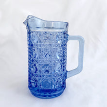 Load image into Gallery viewer, A vintage "Windsor" blue pressed glass pint pitcher. Perfect for cream and milk or repurpose as a flower vase or pencil holder. Crafted by the Federal Glass Company, USA, circa 1970s. The colour is stunning and will add elegance to any tablescape or decor style. In excellent condition, free from chips. Measures 3 1/4 x 5 5/8 inches