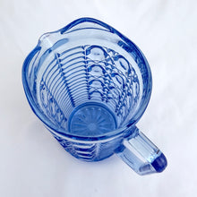 Load image into Gallery viewer, A vintage "Windsor" blue pressed glass pint pitcher. Perfect for cream and milk or repurpose as a flower vase or pencil holder. Crafted by the Federal Glass Company, USA, circa 1970s. The colour is stunning and will add elegance to any tablescape or decor style. In excellent condition, free from chips. Measures 3 1/4 x 5 5/8 inches