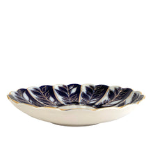 Load image into Gallery viewer, Side profile of vintage Lomonosov Imperial Porcelain saucer dish showing the shallow curved form, ivory unglazed exterior, cobalt blue interior with gold leaf pattern, and scalloped rim edge