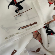 Load image into Gallery viewer, This whimsical contemporary cream coloured cotton linen fabric features a hand printed vintage style limbo/island themed graphic design in black, red, brown and mocha. Crafted by Moygashel Linens in Ireland, known for its high quality textiles. They have been in textile business since 1795! This fabric is very soft and would be perfect for dressmaking, or home decor. In excellent condition, free from stains/tears. Measures 36 x 144 inches
