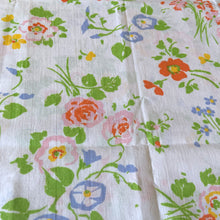 Load image into Gallery viewer, This delightful pair of vintage Wondercale Gardens floral pillowcases features colourful flower blossoms of roses, poppies and morning glories in shades of pink, orange, blue, yellow and green on a white ground. 50% cotton 50% polyester. Crafted by Springmaid, USA, 1976. Add vintage charm to your bedroom with these beauties!
In excellent like-new condition, no stains or tears.
Measures 31 x 20 1/2 inches