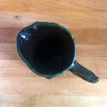 Load image into Gallery viewer, This gorgeous Evangeline pitcher features a stunning design of raised mushrooms and knots around a tree trunk. This sweet pitcher makes for a beautiful statement piece or a functional pitcher for your home. In excellent condition, free from chips/cracks. Measures 3 3/4 x 6 3/8 inches