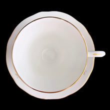 Load image into Gallery viewer, Vintage Woodside white bone china teacup and saucer features purple violets, trimmed in gold gilt. Crafted by Duchess, England, 1960s. A lovely way to enjoy a cuppa tea!
In excellent condition, no chips, cracks or repairs. Maker's mark on the bottom.
Measures 3 7/8 x 2 3/4 x 5 1/2 inches