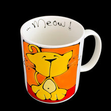 Load image into Gallery viewer, Vintage white ceramic mug featuring an artisan designed and hand painted dimensionally (puffy) illustrated yellow cat set against an orange and red background, outlined in black with an inscription on the interior that reads "...Meow!". Crafted by Ketto Design, Canada, circa 1998. This Quebec company no longer produces these mugs making them hard to find and highly collectible. In excellent used condition, free from chips/cracks/repairs. Measures 3 1/8 x 3 3/4 inches Capacity 8 ounces