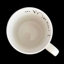 Load image into Gallery viewer, Vintage white ceramic mug featuring an artisan designed and hand painted dimensionally (puffy) illustrated yellow cat set against an orange and red background, outlined in black with an inscription on the interior that reads "...Meow!". Crafted by Ketto Design, Canada, circa 1998. This Quebec company no longer produces these mugs making them hard to find and highly collectible. In excellent used condition, free from chips/cracks/repairs. Measures 3 1/8 x 3 3/4 inches Capacity 8 ounces
